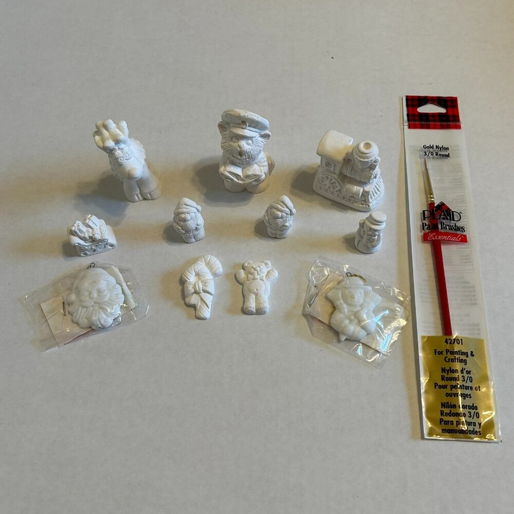 Bundle of 11 white paintable Christmas ornaments/figurines & a sealed paintbrush